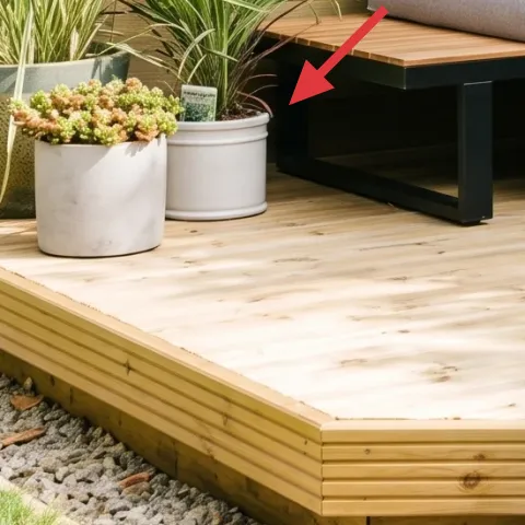 Large white planter pot with green grass