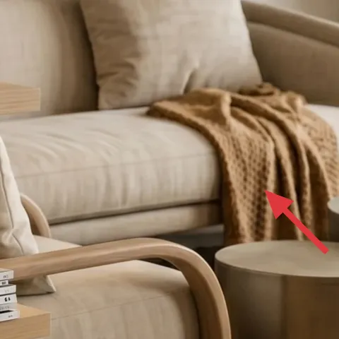 tan throw blanket draped on sofa