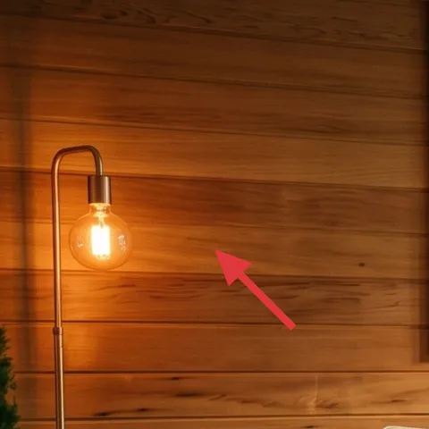 tall metal floor lamp with exposed bulb