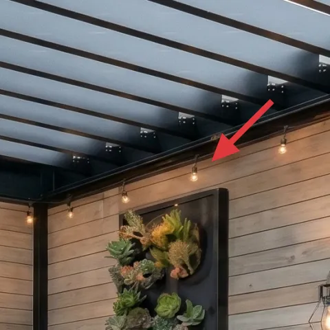 string lights on black ceiling grid