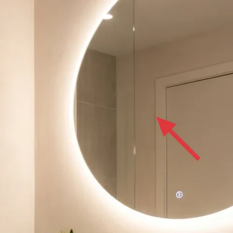 Warm white wall paint around the mirror