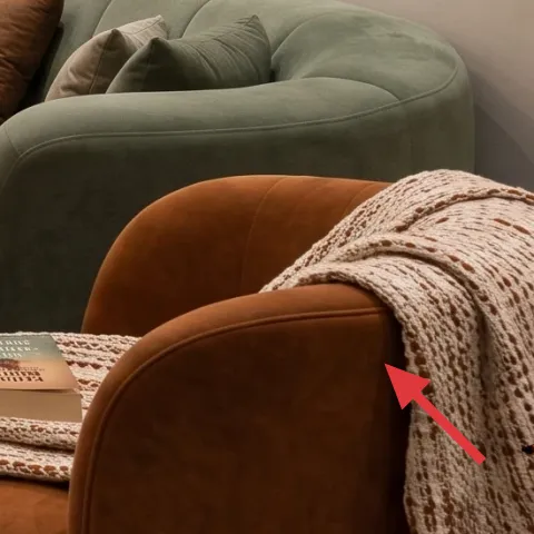 throw blanket (cream knit, draped)
